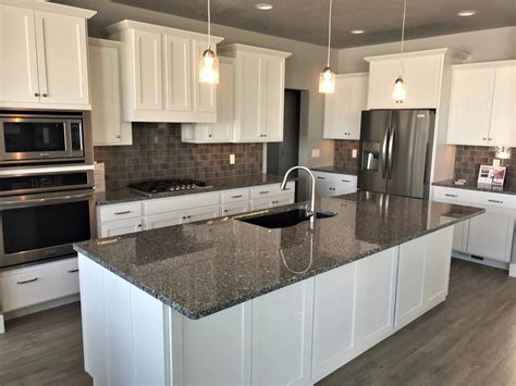 white kitchen cabinets steel grey granite countertops|white cabinet farmhouse kitchen backsplash.